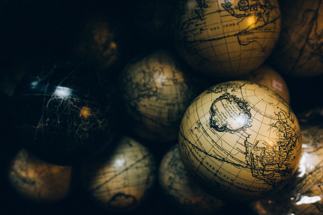 Some old terrestrial globe balls in a dark light
